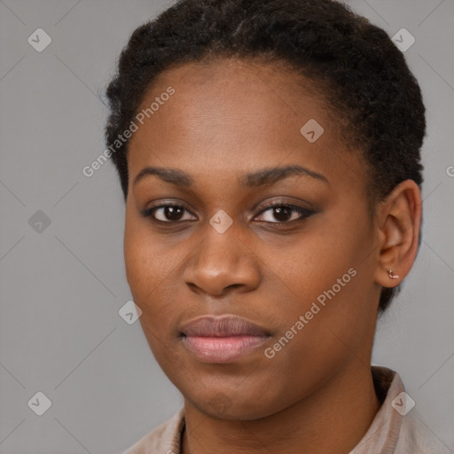 Joyful black young-adult female with short  brown hair and brown eyes