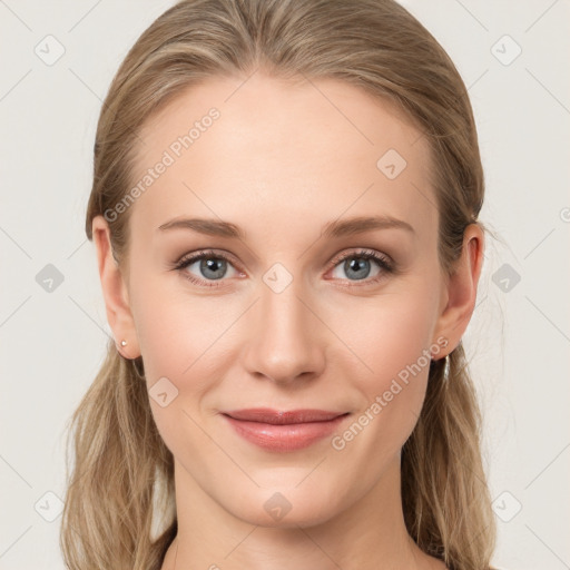 Joyful white young-adult female with long  brown hair and blue eyes