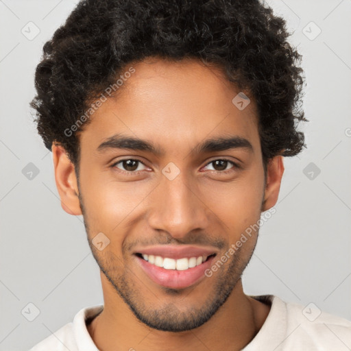 Joyful latino young-adult male with short  brown hair and brown eyes