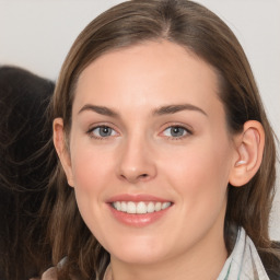 Joyful white young-adult female with long  brown hair and grey eyes