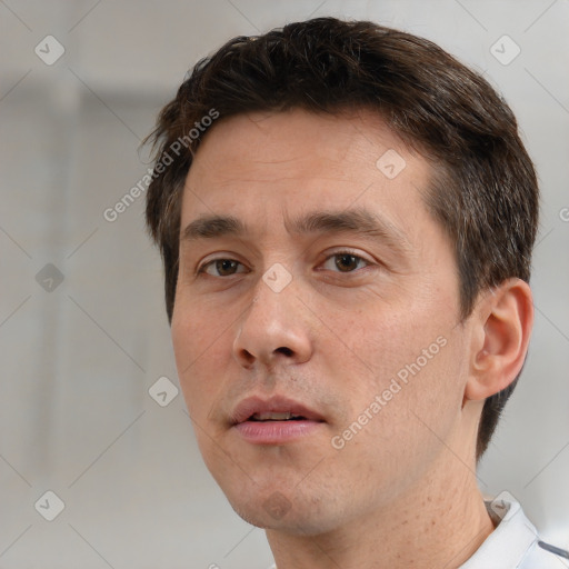 Neutral white adult male with short  brown hair and brown eyes