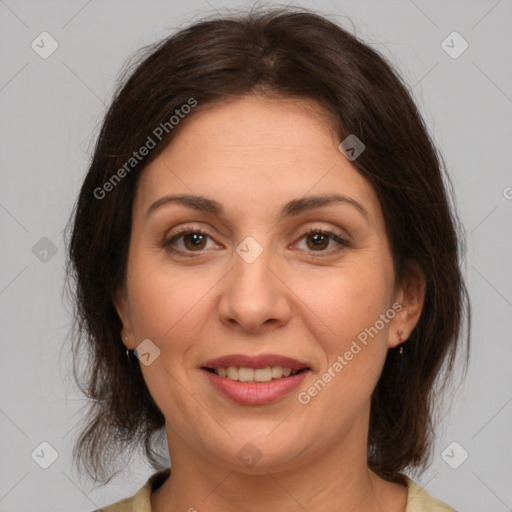 Joyful white adult female with medium  brown hair and brown eyes