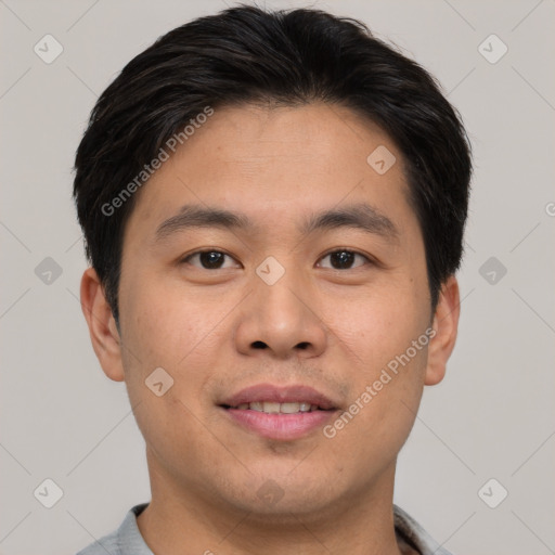 Joyful asian young-adult male with short  brown hair and brown eyes