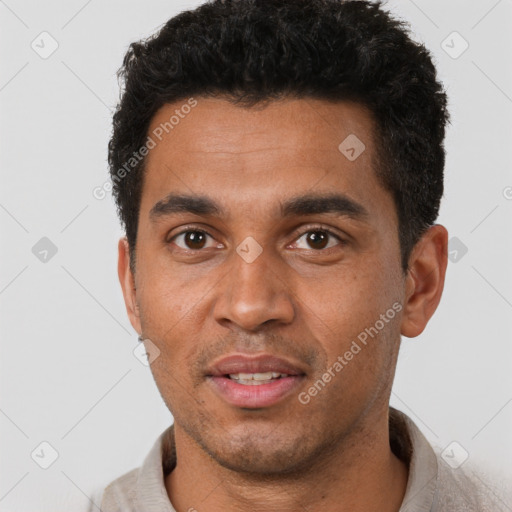 Joyful black young-adult male with short  black hair and brown eyes