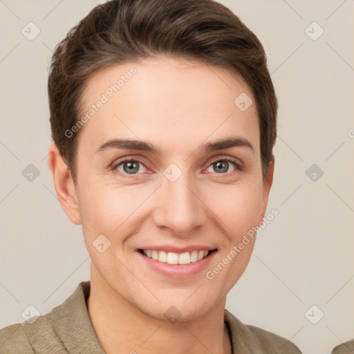 Joyful white young-adult female with short  brown hair and grey eyes