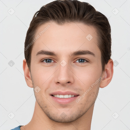 Joyful white young-adult male with short  brown hair and grey eyes