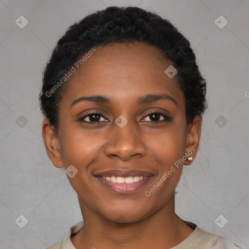 Joyful black young-adult female with short  black hair and brown eyes