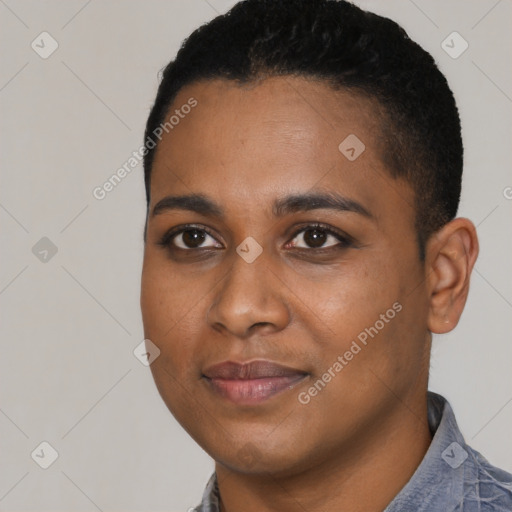 Joyful black young-adult female with short  black hair and brown eyes