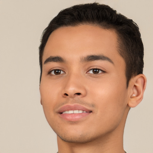 Joyful latino young-adult male with short  black hair and brown eyes