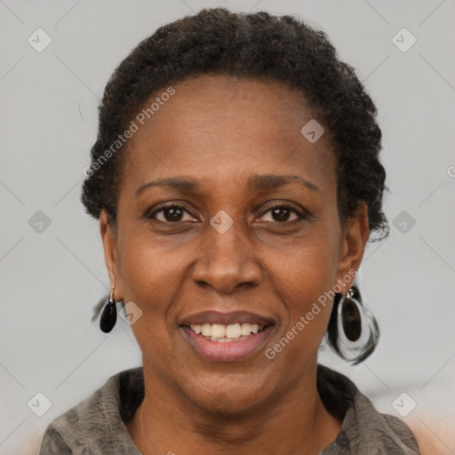 Joyful black adult female with short  brown hair and brown eyes