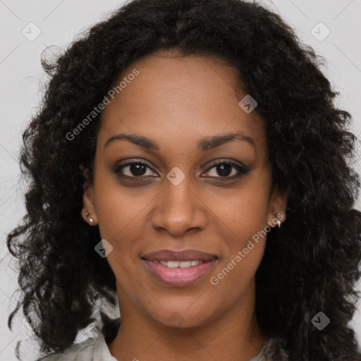 Joyful black young-adult female with long  brown hair and brown eyes