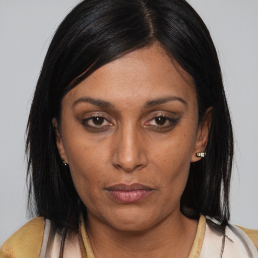 Neutral asian adult female with medium  brown hair and brown eyes