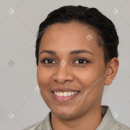 Joyful latino young-adult female with short  black hair and brown eyes