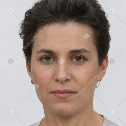 Joyful white adult female with short  brown hair and brown eyes