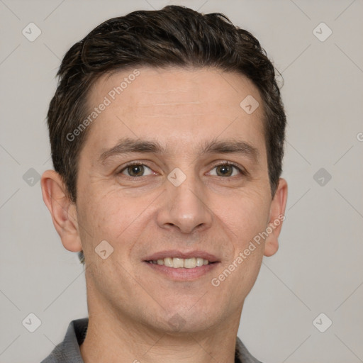 Joyful white adult male with short  brown hair and grey eyes