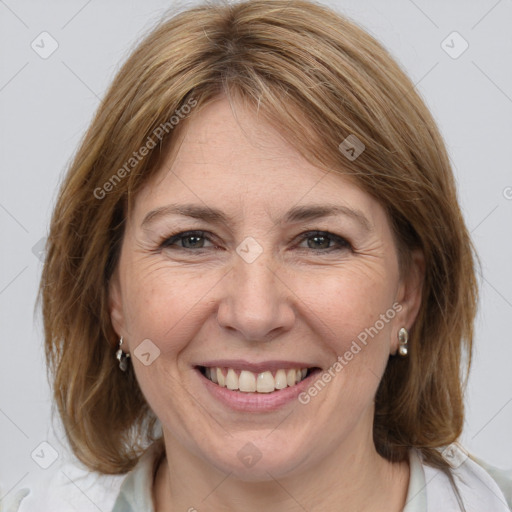 Joyful white adult female with medium  brown hair and brown eyes