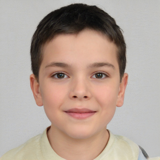 Joyful white child male with short  brown hair and brown eyes