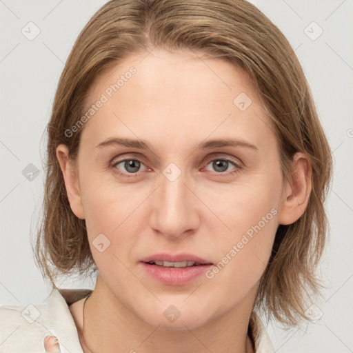 Joyful white young-adult female with medium  brown hair and blue eyes