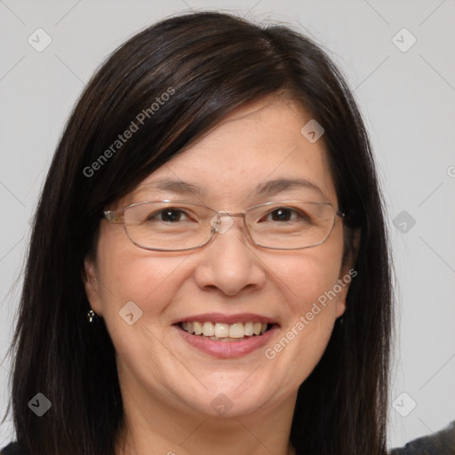 Joyful white adult female with long  brown hair and brown eyes