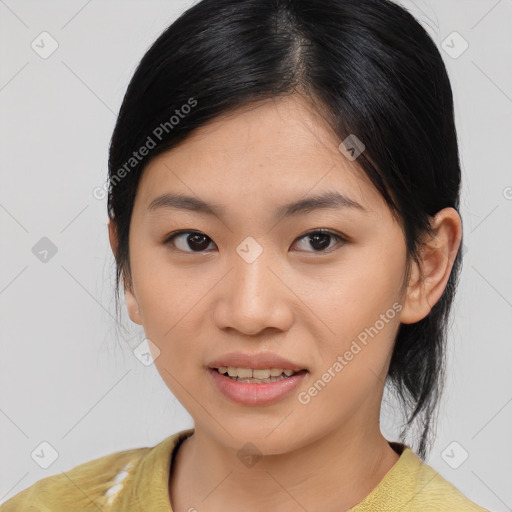 Joyful asian young-adult female with medium  black hair and brown eyes