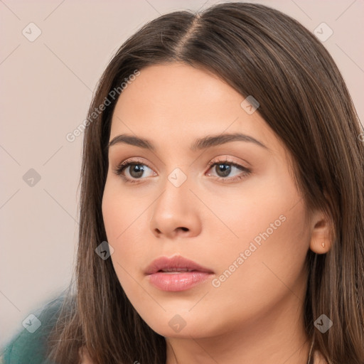 Neutral white young-adult female with long  brown hair and brown eyes