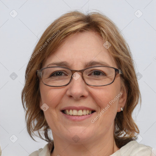 Joyful white adult female with medium  brown hair and blue eyes