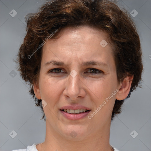 Joyful white adult female with short  brown hair and brown eyes