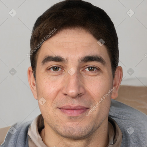 Joyful white adult male with short  brown hair and brown eyes