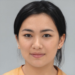 Joyful asian young-adult female with medium  black hair and brown eyes