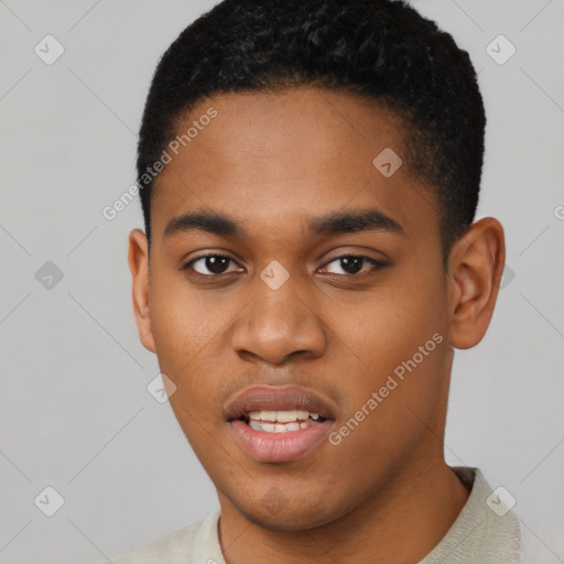 Joyful black young-adult male with short  black hair and brown eyes