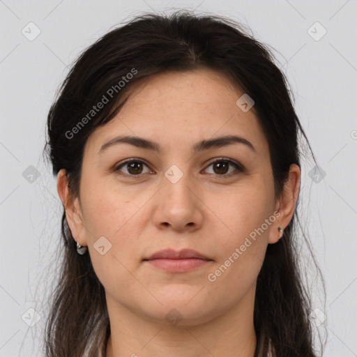 Joyful white young-adult female with long  brown hair and brown eyes