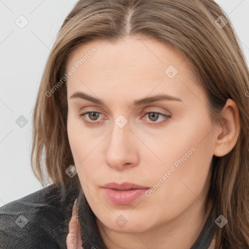 Neutral white young-adult female with long  brown hair and brown eyes