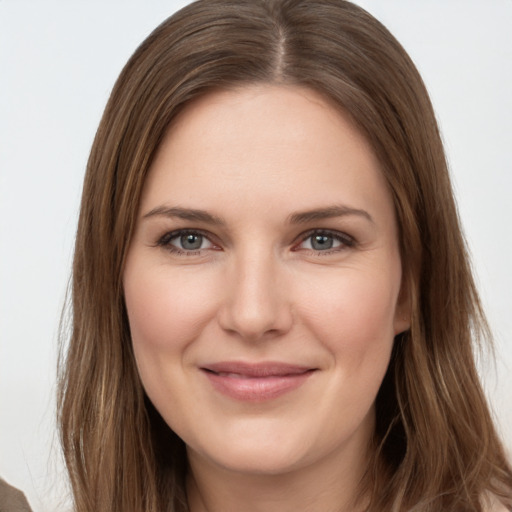 Joyful white young-adult female with long  brown hair and grey eyes