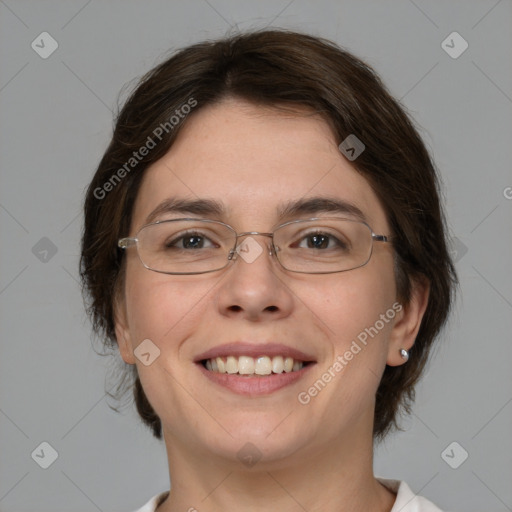 Joyful white adult female with medium  brown hair and brown eyes