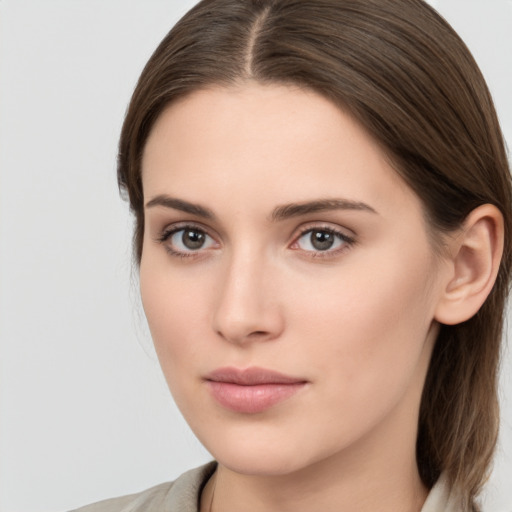 Neutral white young-adult female with medium  brown hair and brown eyes