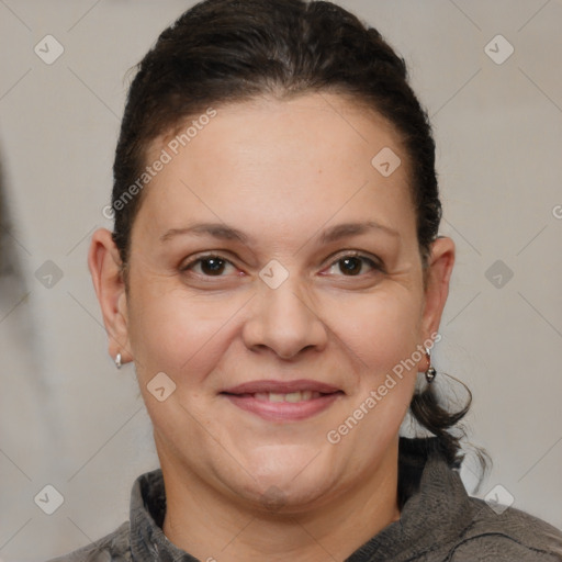 Joyful white adult female with short  brown hair and brown eyes