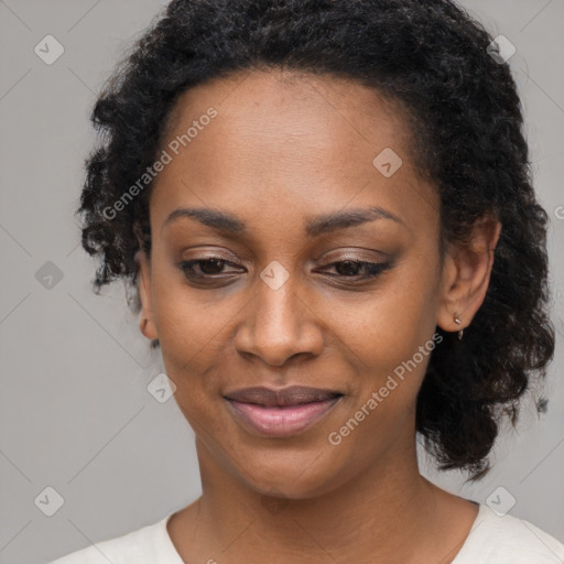 Joyful black young-adult female with medium  black hair and brown eyes