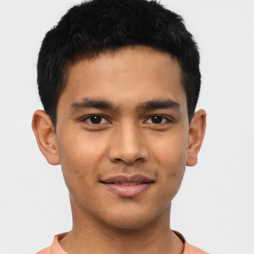 Joyful asian young-adult male with short  brown hair and brown eyes