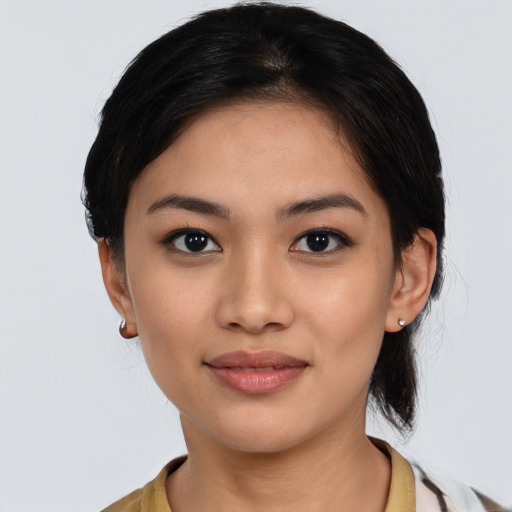 Joyful latino young-adult female with medium  black hair and brown eyes
