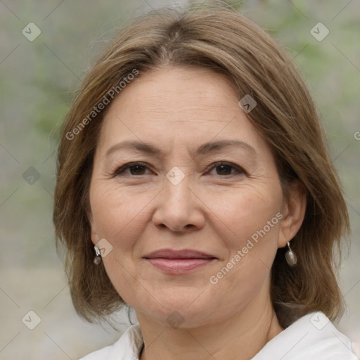 Joyful white adult female with medium  brown hair and brown eyes