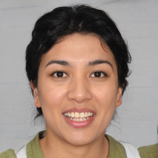 Joyful white young-adult female with medium  black hair and brown eyes