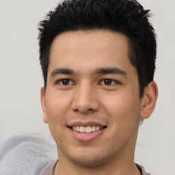 Joyful asian young-adult male with short  black hair and brown eyes