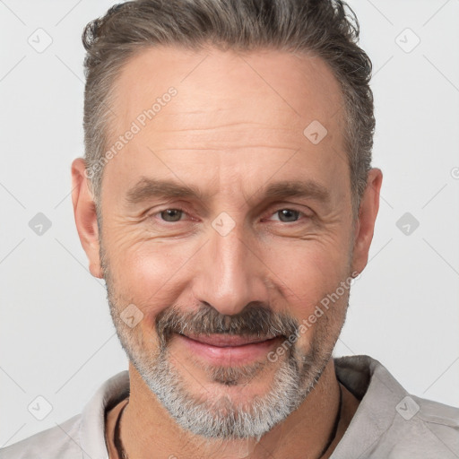 Joyful white middle-aged male with short  brown hair and brown eyes