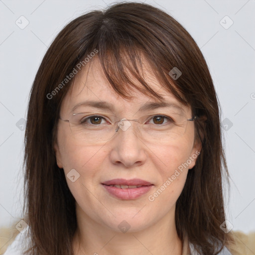 Joyful white adult female with medium  brown hair and grey eyes