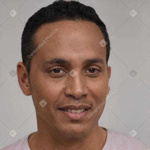 Joyful latino young-adult male with short  brown hair and brown eyes