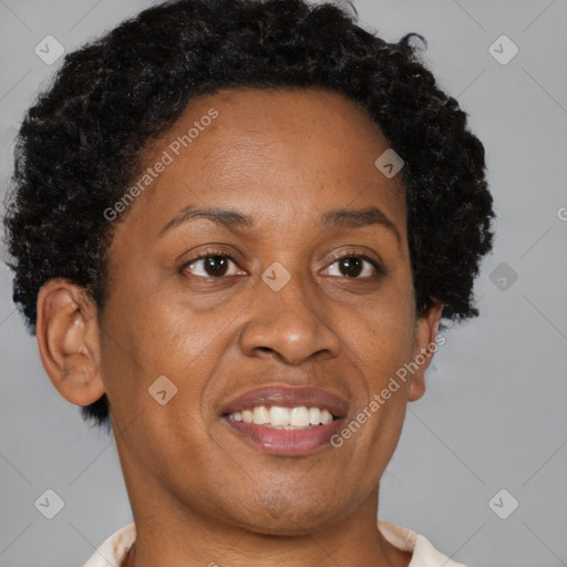 Joyful black adult female with short  brown hair and brown eyes