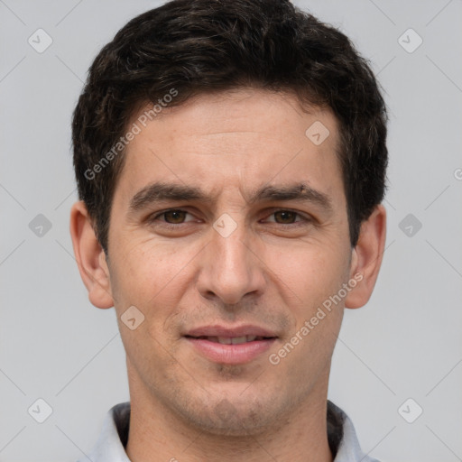 Joyful white adult male with short  brown hair and brown eyes