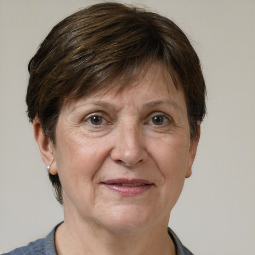 Joyful white middle-aged female with short  brown hair and brown eyes