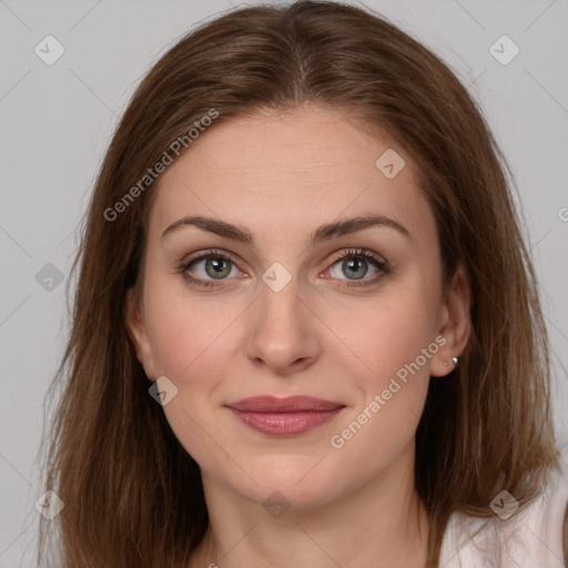 Joyful white young-adult female with long  brown hair and grey eyes