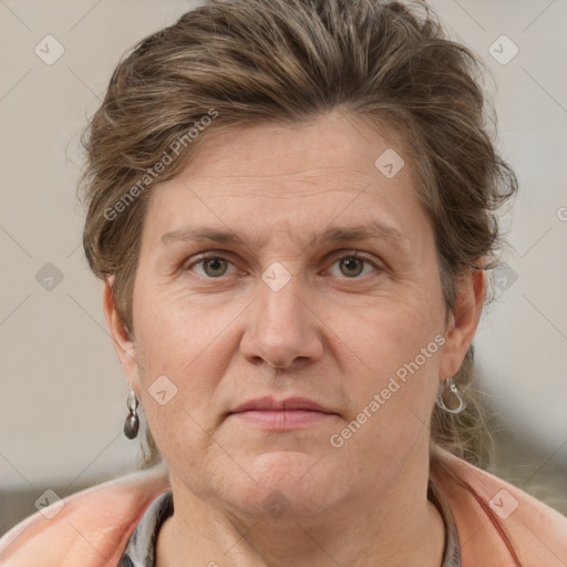 Joyful white adult female with short  brown hair and grey eyes